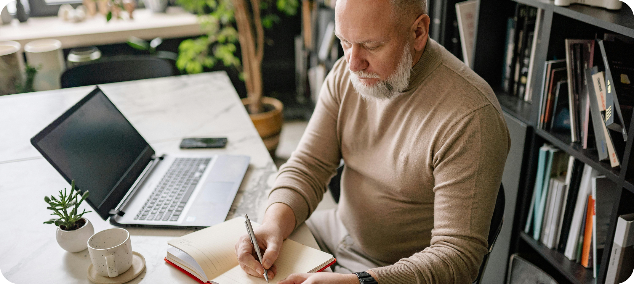 Person reviewing notes and expenses at a desk